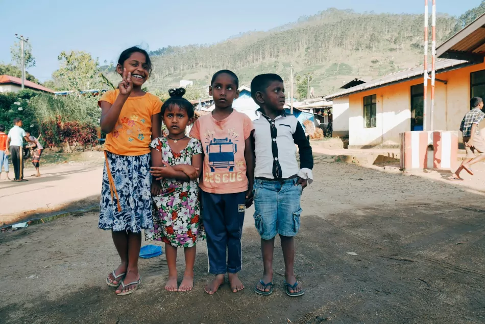 Four youg Sri Lankan children standing together